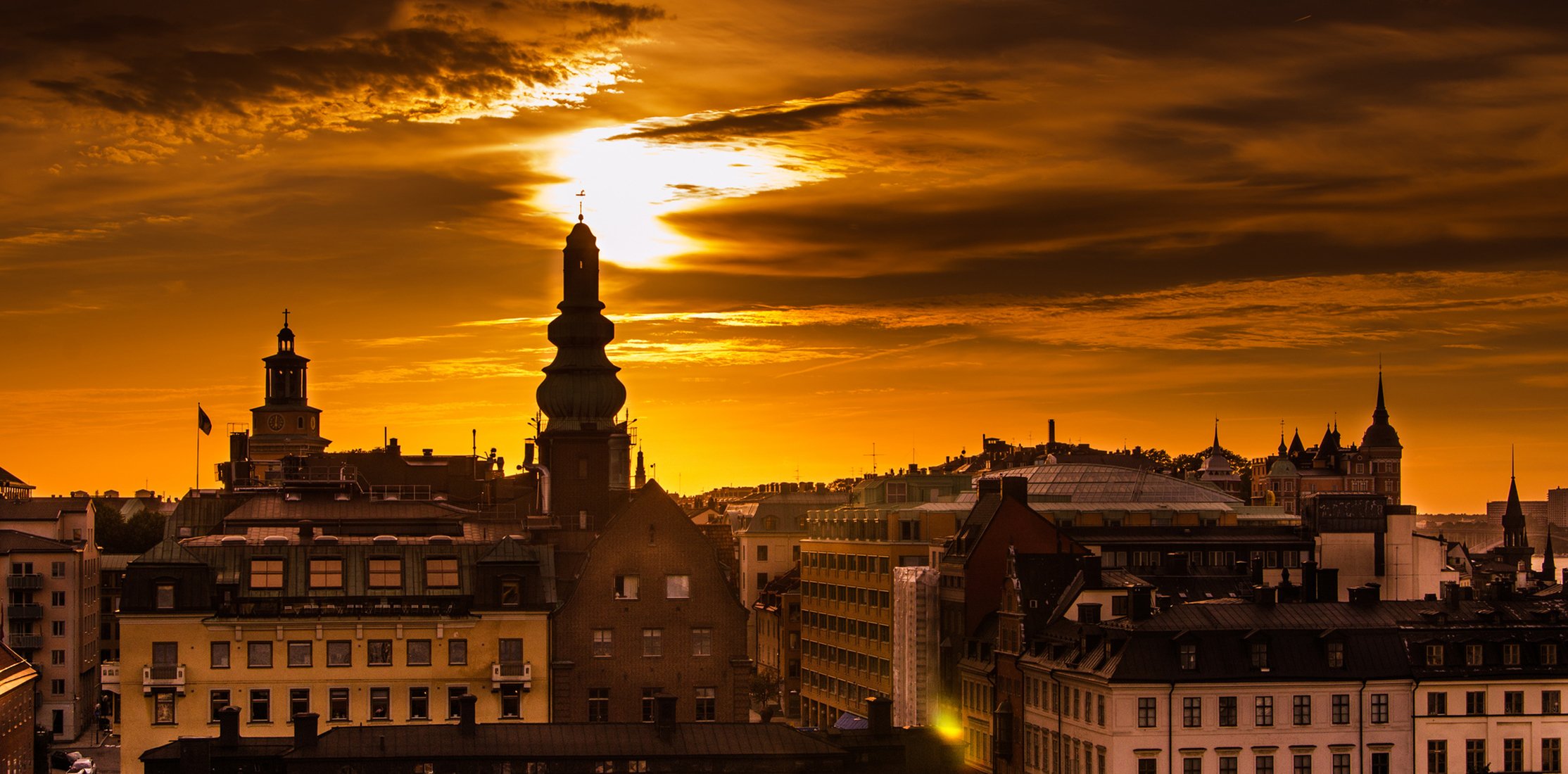 weden stockholm morning dawn sky sun light houses buildings roofs city