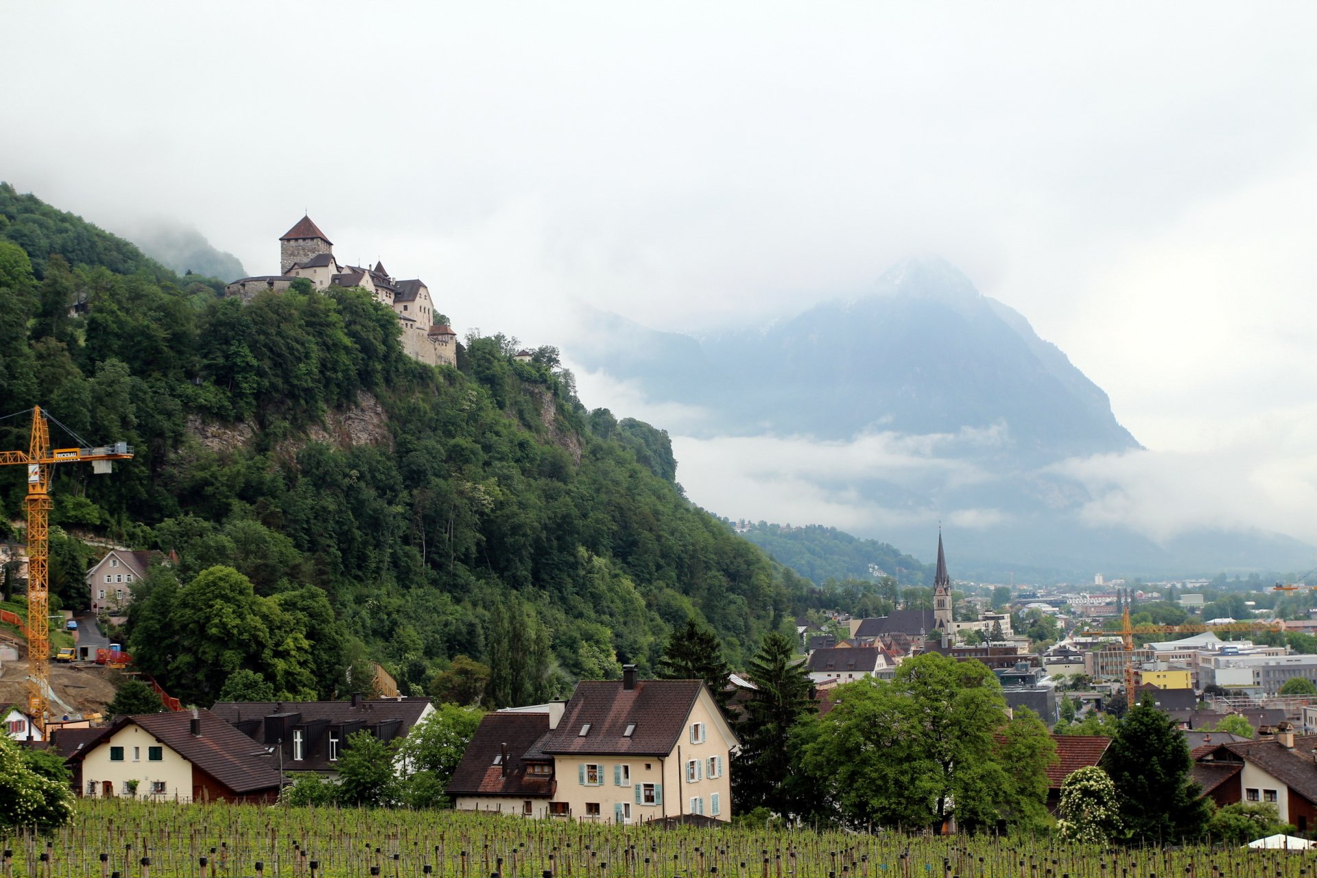 liechtenstein vaduz city town houses castle mountains rocks landscape