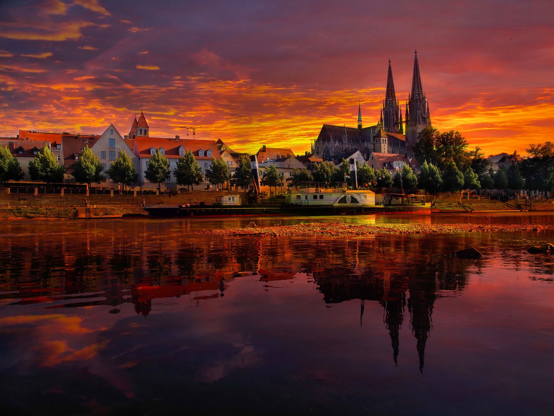 regensburg germany sunset landscape river house sky clouds boat ship cathedral reflection