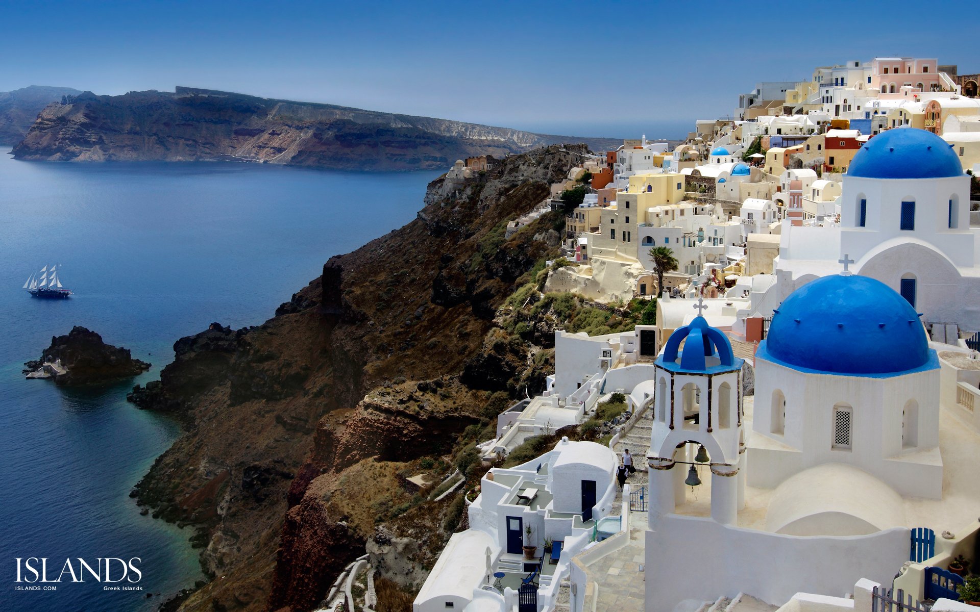 morze egejskie grecja santorini oia wieczór miasto latarnie kościół kopuła domy