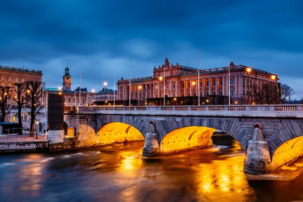 Stockholm Bridge is illuminated by lanterns in the evening