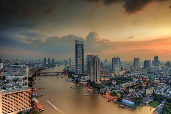 Bangkok s tall houses by the river