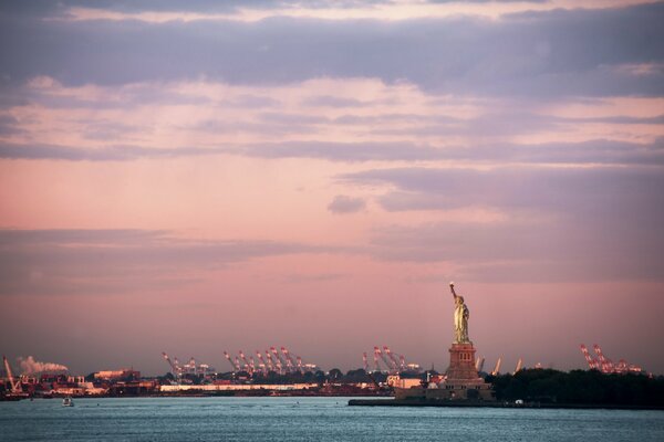 The Statue of Liberty meets us on the water