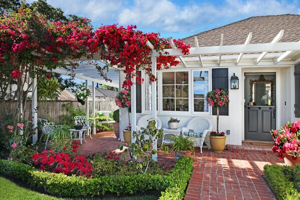 Cozy house, in a flower garden