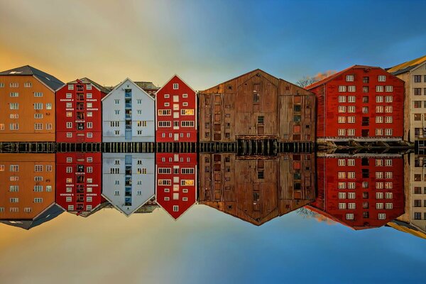 Houses reflected on the smooth surface of the water