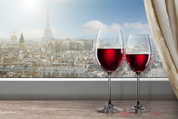 Sul davanzale della finestra ci sono due bicchieri di vino rosso