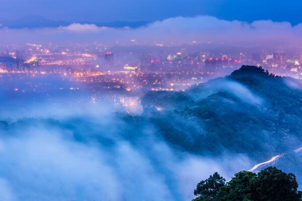 Lights of the evening city in the fog