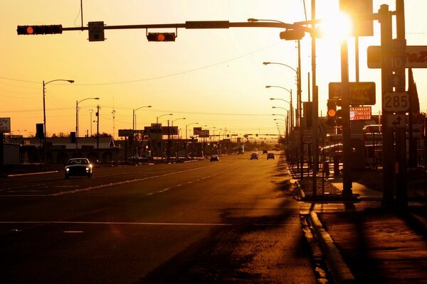 Highway going into the sunset with the sun