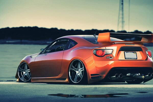 Sporty Toyota orange on the track