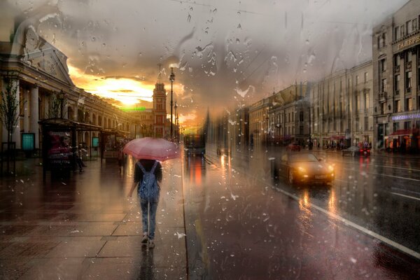 A girl with an umbrella in rainy weather