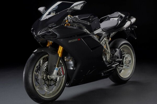 Black Ducatti motorcycle on a black background