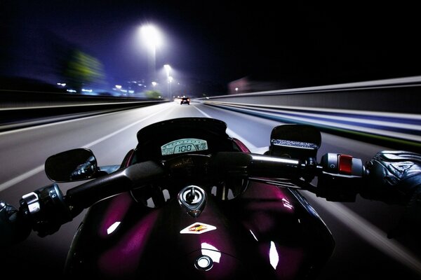 Night ride on a motorcycle first-person view