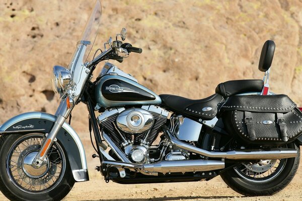 Superb black Harley on a sand background