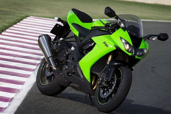 Green motorcycle on the track