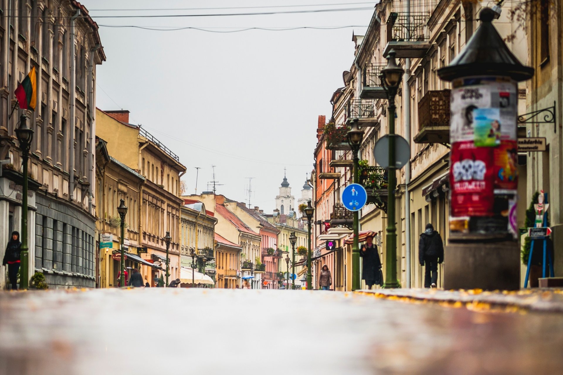 kaunas lietuva lithuania town autumn road street lamps shops buildings house people