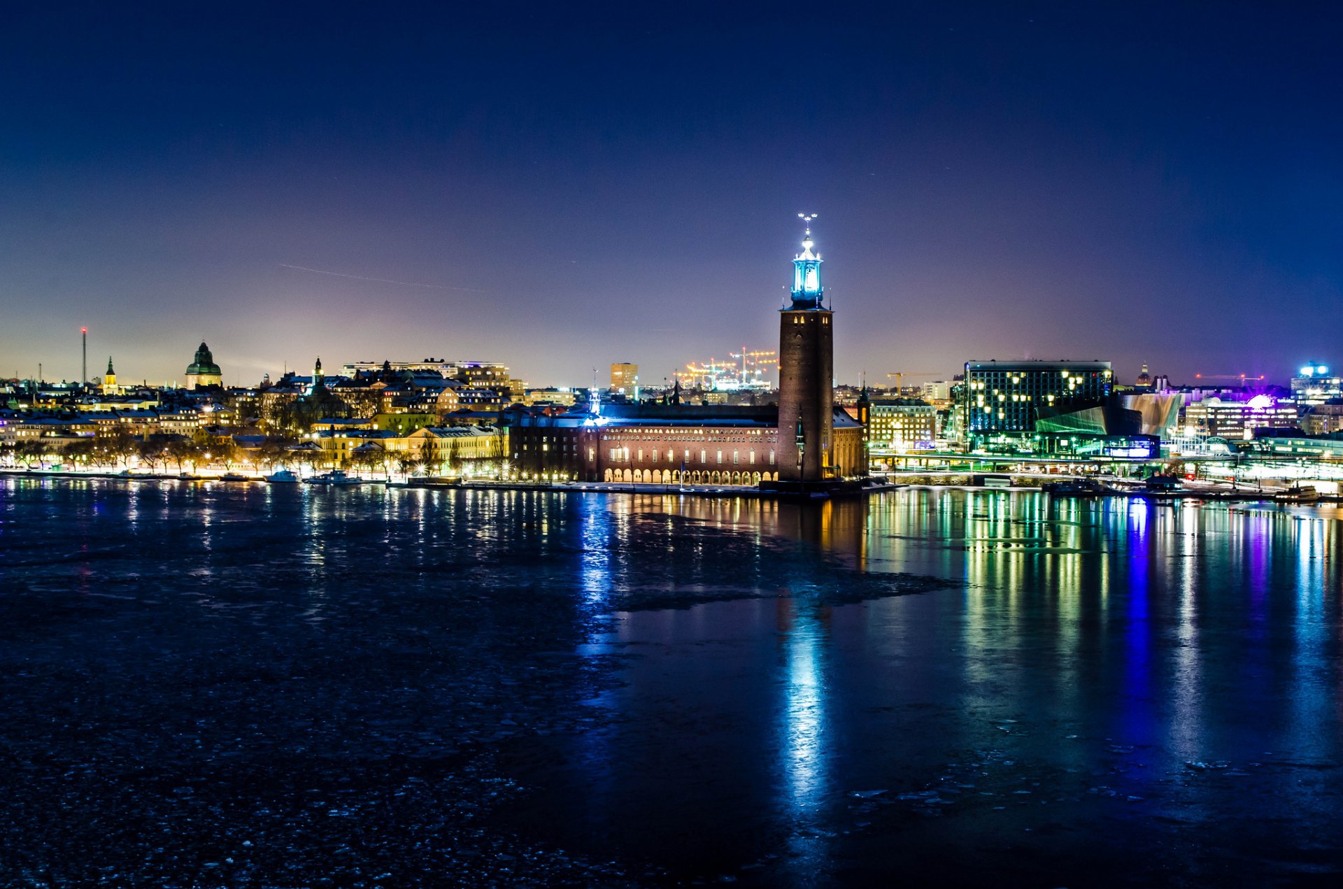 weden stockholm winter night town hall lights reflection