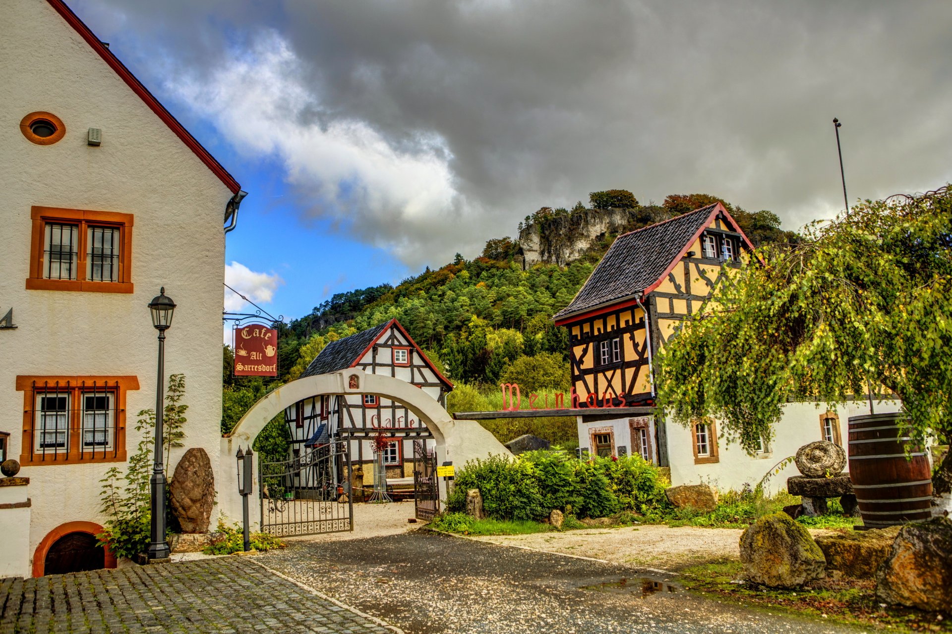 germany gerolstein town lane houses cafe fence gates sky cloud