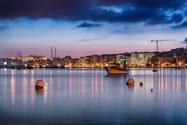 Malta coast with pink and blue sky