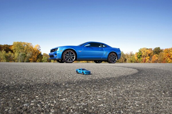 The model of the car on the background of the original