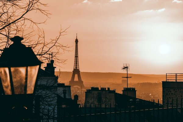 Eiffel Tower in the distance in a brown fog