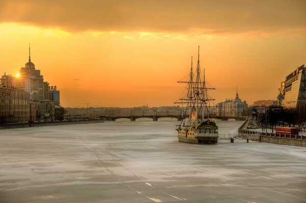 A ship on the frozen Neva in the rays of the rising sun