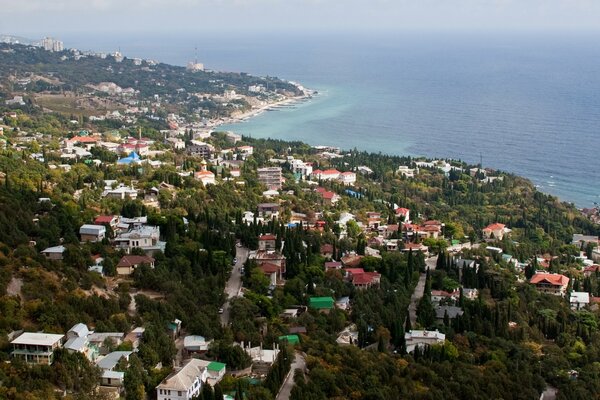 Houses on the coast by the sea top view