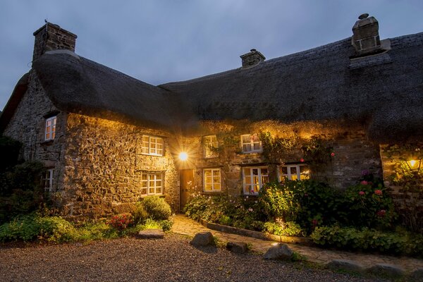 Yellow lighting of a stone house