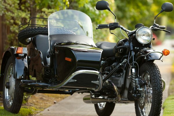 Soviet motorcycle bike on the background of trees