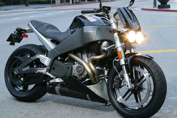 Headlights lit up on a motorcycle after repair