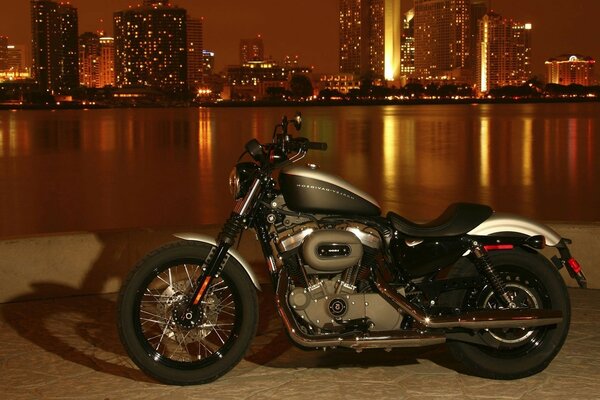 Harley davidson motorcycle on the evening embankment