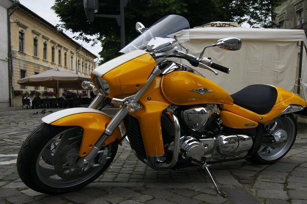 Cool yellow bike in the parking lot