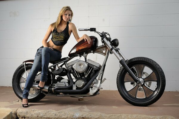 Beautiful blonde sitting on a motorcycle