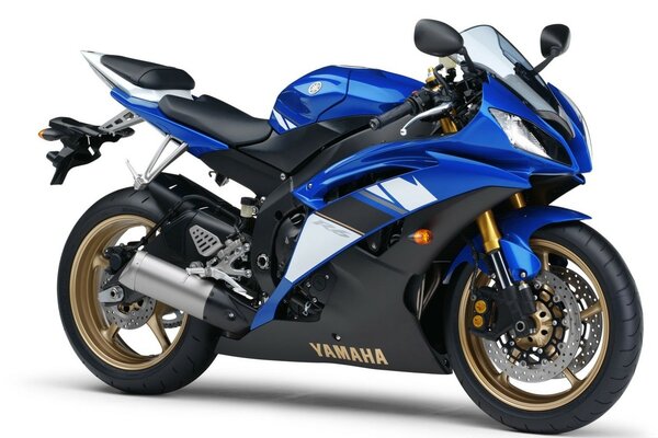 On a white background, a blue Yamaha sports motorcycle