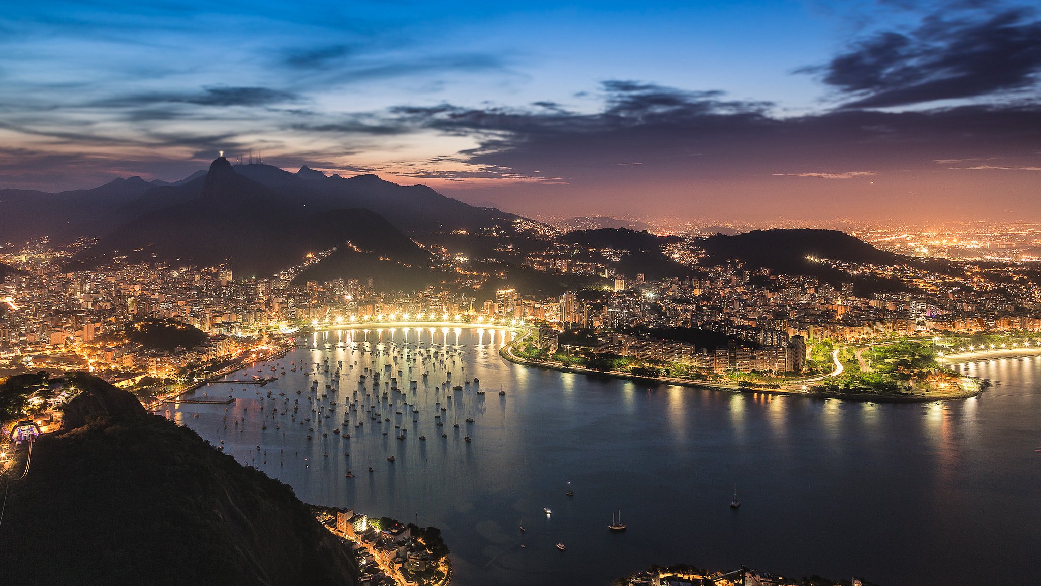 brasile rio de janeiro guanabara baia baia sera tramonto cielo nuvole città luci illuminazione vista panorama