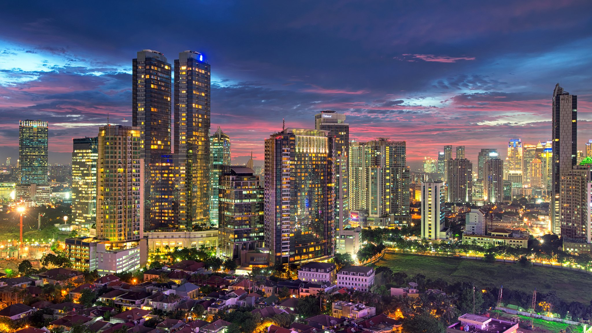 jakarta indonesia evening city capital metropolis capital skyscrapers houses buildings lighting light