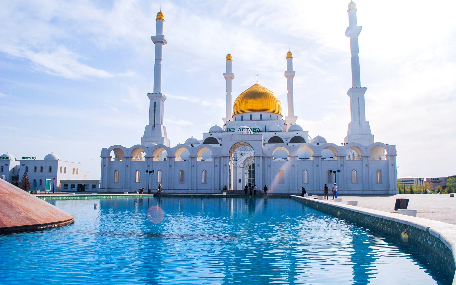 astana kazakhstan mosque minaret fountain people