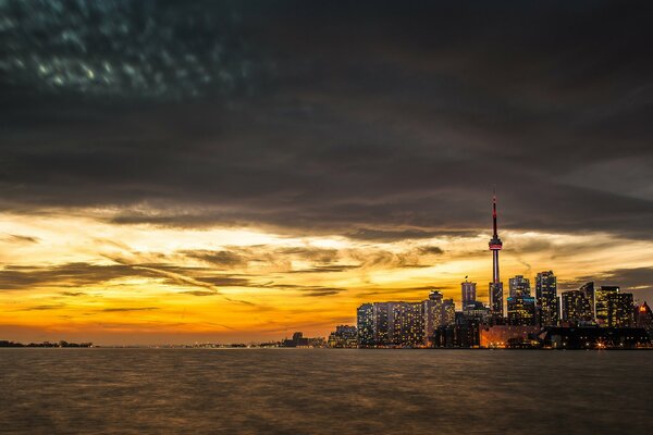 Beautiful sunset on the background of the city of Toronto