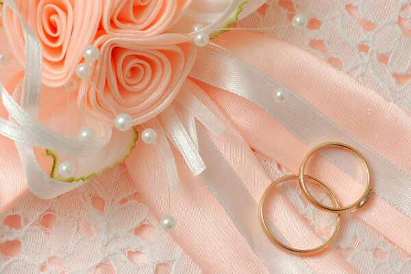 Wedding composition in peach tones with rings