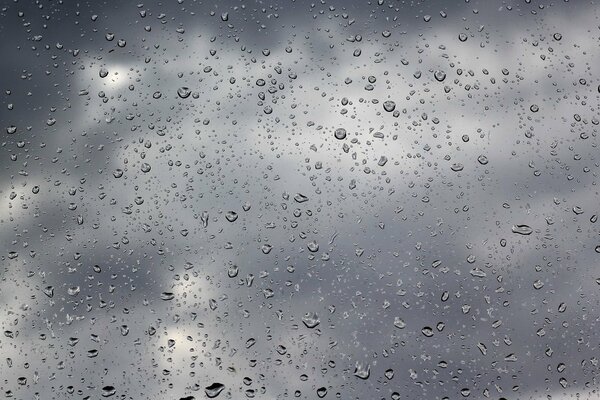 Cloudy weather and raindrops on the glass