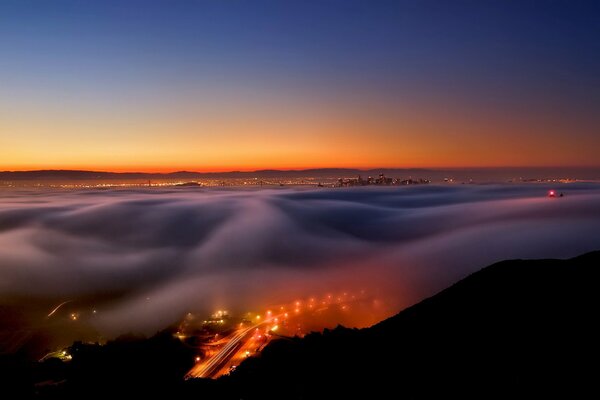 Landscape of fog in the night over the city