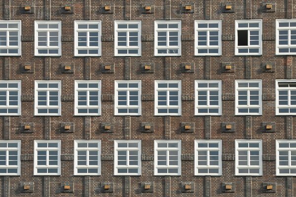 Brutal brick wall with windows