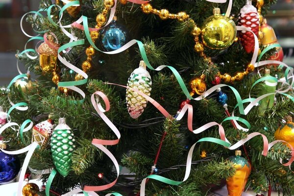 Christmas tree with tinsel and toys-cones