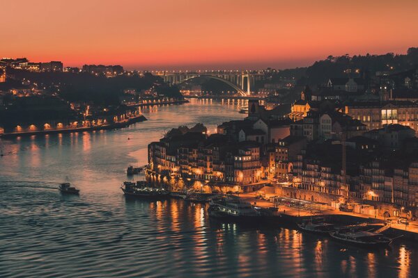 Portuguese city shrouded in evening lights