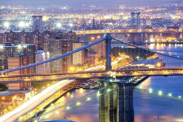 Night city with a bridge and a view of the river