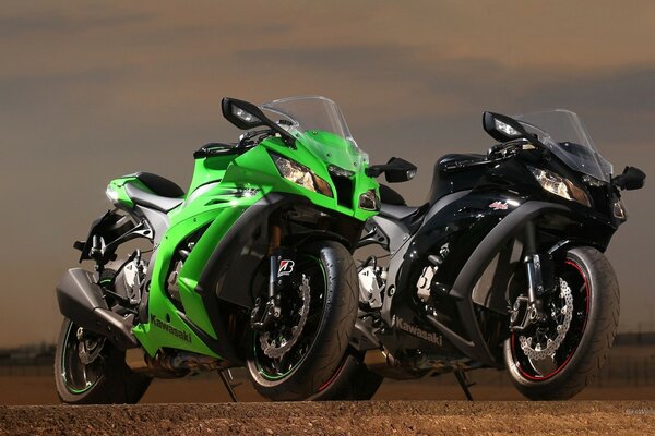 Two Kawasaki motorcycles green and black