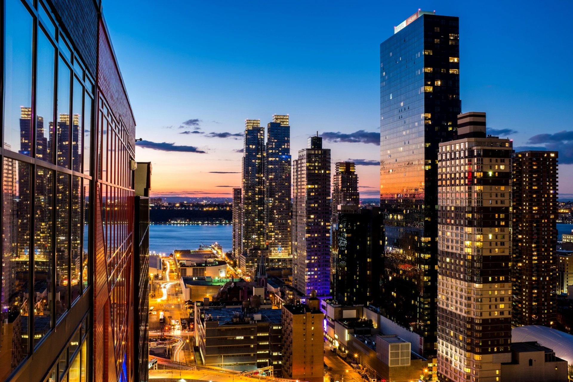 new york usa city evening sky clouds sunset skyscrapers lights lights windows building