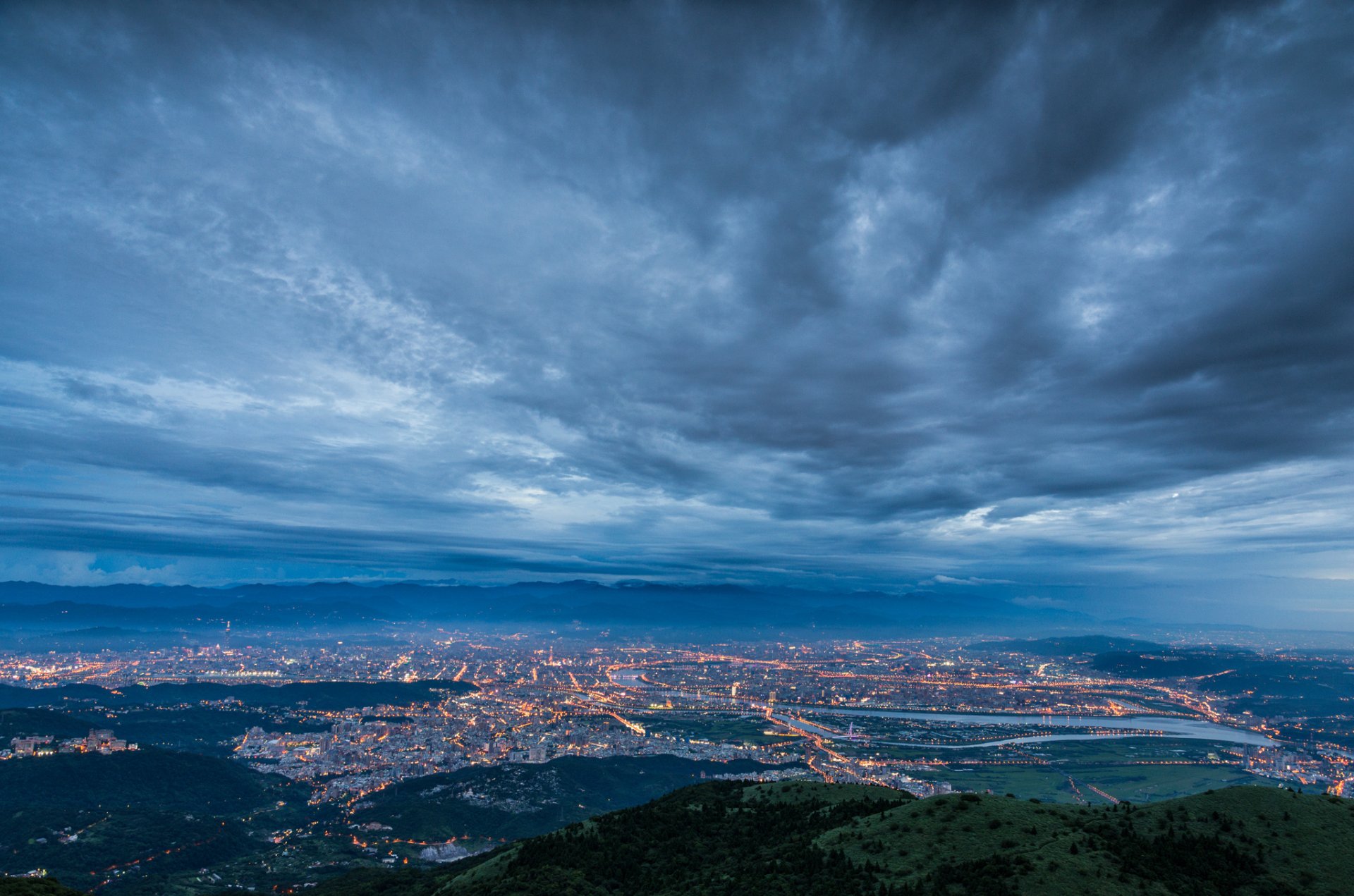 china prc taiwan taipei city strait evening twilight turquoise dark blue sky clouds fog haze lights lighting view altitude panorama