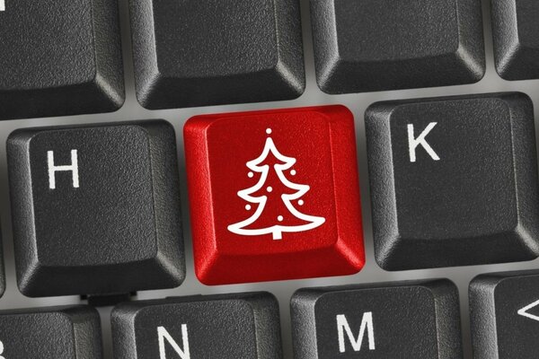 Tecla roja-árbol de Navidad en el teclado de la computadora