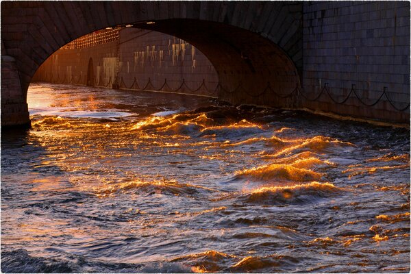 A splash of waves with a glint of the sun