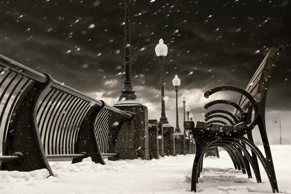 Benches and lanterns on the winter streets of Canada